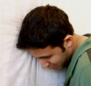 Security Blanket listening wall with kneeling listener